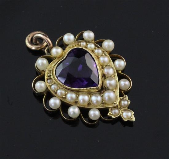 An Edwardian style gold, amethyst and split pearl heart shaped pendant, 1in.